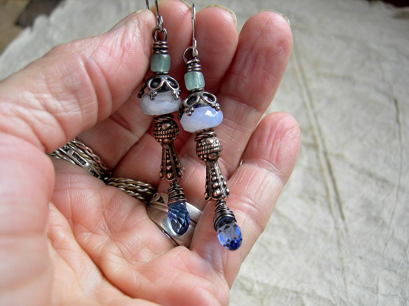 Boho luxe, detailed earrings with blue gemstone, crystal tear drops & vintage Java glass beads. Antiqued copper caps & wire wrap. 