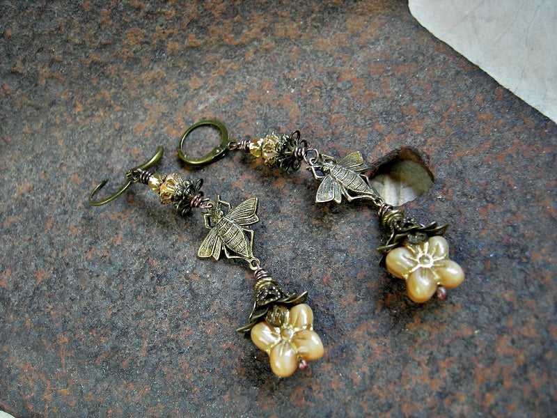Long drop earrings, in late summer gold with bronze bee connectors, glass flowers & faceted beads & antiqued brass filigree caps. 