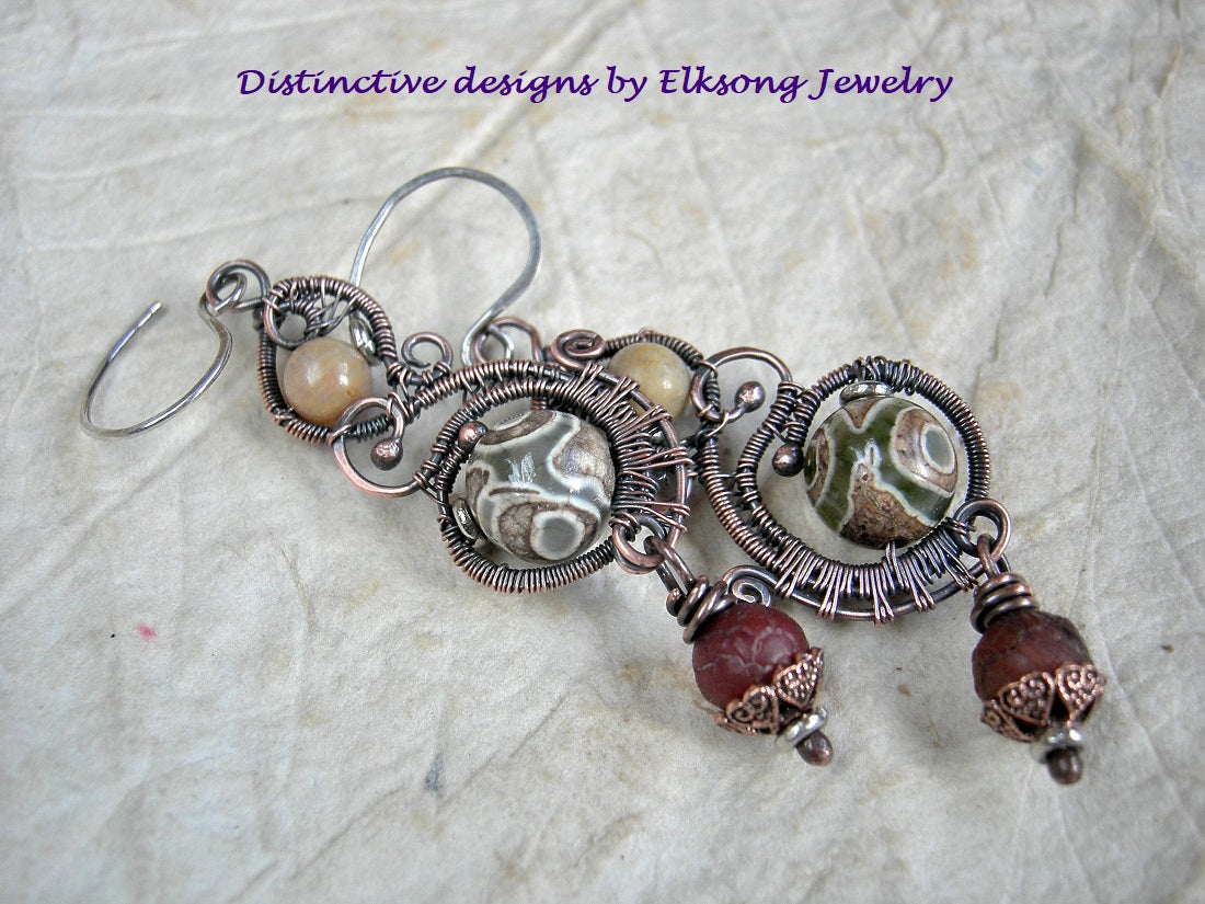 Copper wire wrap paisley style earrings with russet fall color gemstone beads. 