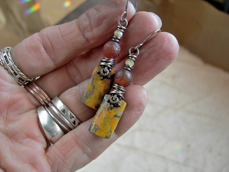 Naturally colorful bumblebee jasper earrings, hand cut stone tabs with carnelian, yellow opal & sterling wire wrap. 
