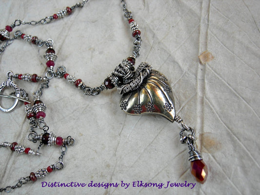 Crimson gemstone & silver heart pendant with sterling wire wrap & faceted garnet and crystal beads. 