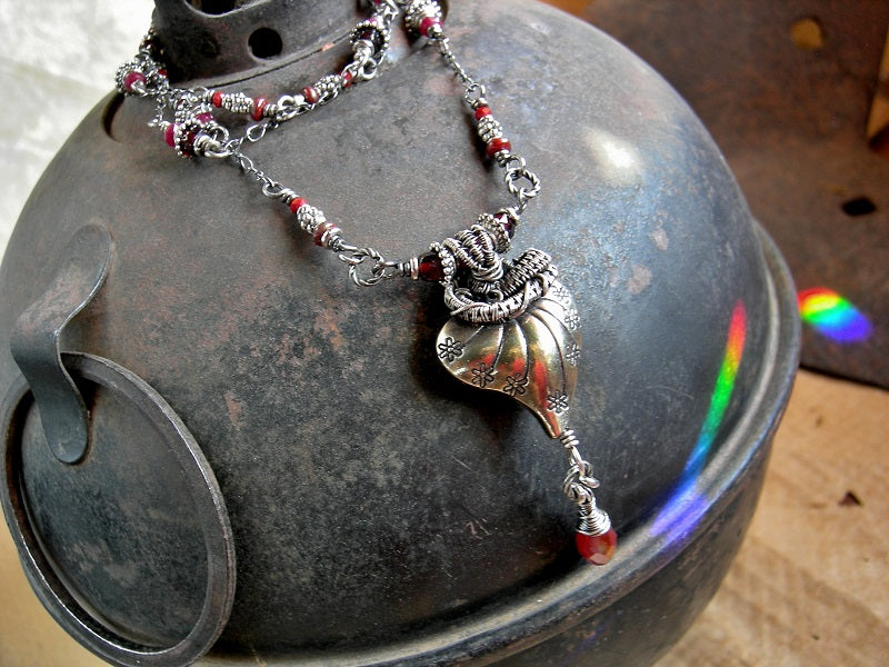 Silver heart & red bead pendant with sterling wire wrap & faceted garnet and crystal beads. 
