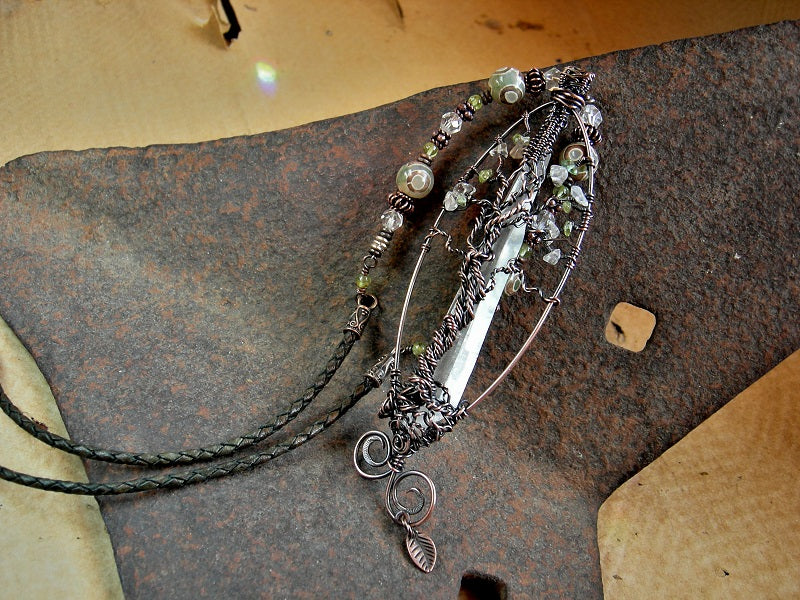LOTR inspired tree necklace with copper wire wrap & natural quartz crystal point, crystal & peridot beads, leather cord. 
