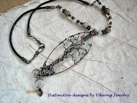 Elvish tree necklace with copper wire wrap & natural quartz crystal point, crystal & peridot beads, leather cord. 