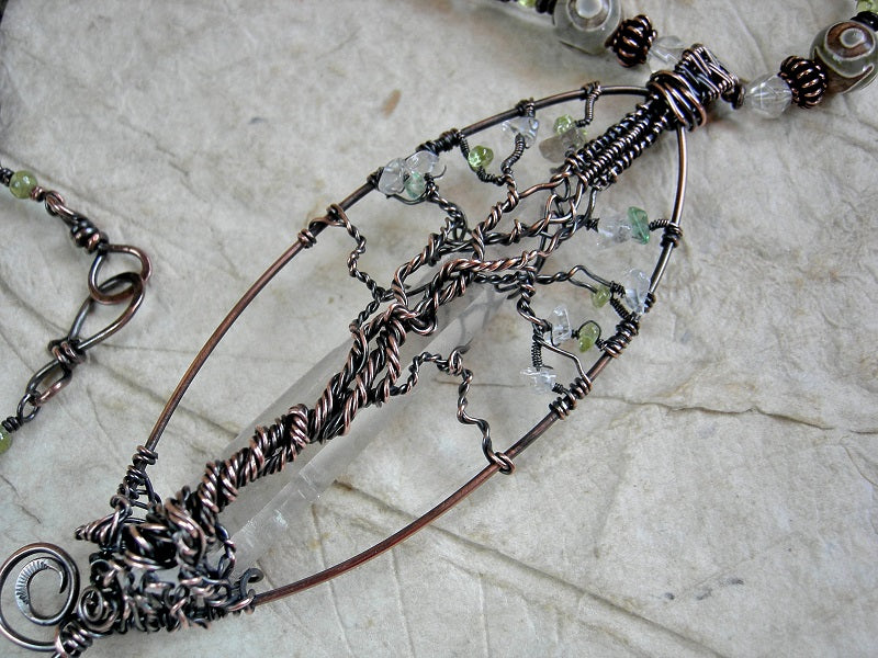 Copper wire wrap tree & natural quartz crystal point necklace with crystal, agate & peridot beads, leather cord. 