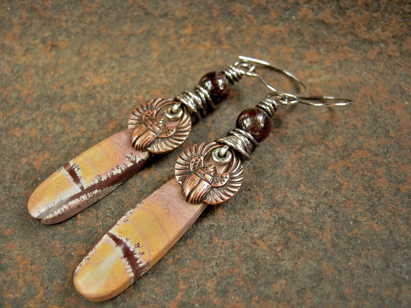 Earthy desert color earrings with hand cut dendritic jasper, copper scarabs & deep red garnet. Sterling wire wrap & handmade ear wires. 