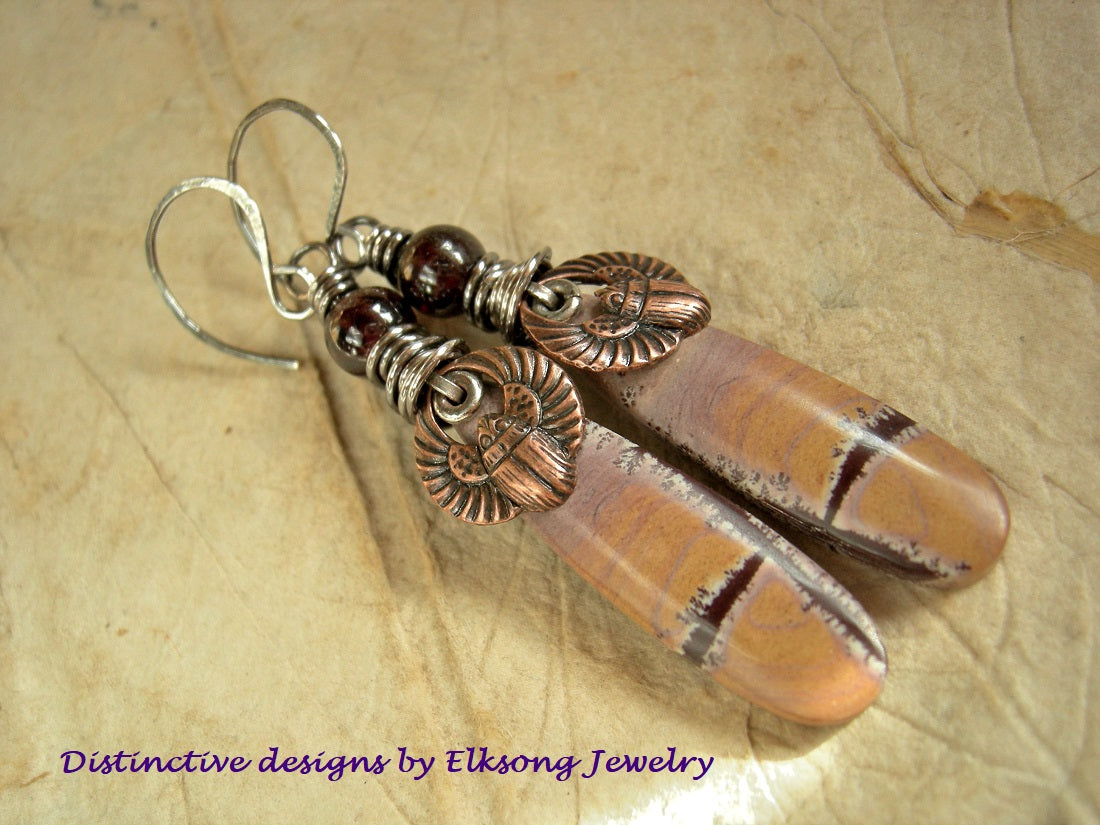 Desert Queen earrings with hand cut dendritic jasper, copper scarabs & deep red garnet. Sterling wire wrap & handmade ear wires. 