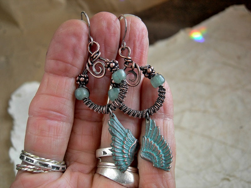 Bohemian copper wire wrap earrings, coiled hoops with aqua Java glass & copper beads, verdigris copper wing charms.