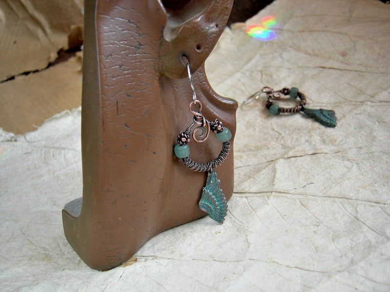 Copper wire wrap earrings, coiled hoops with aqua Java glass & copper beads, verdigris copper wing charms.