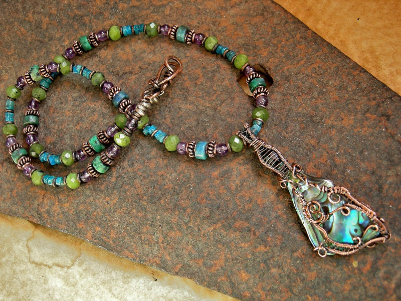 Strung gemstone bead necklace with natural abalone shell & copper wire wrap focal, amethyst, jade, apatite beads. 