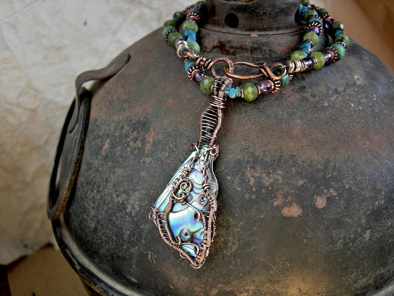 Boho beach necklace with natural abalone shell & copper wire wrap focal, purple, green & aqua gemstone beads. 
