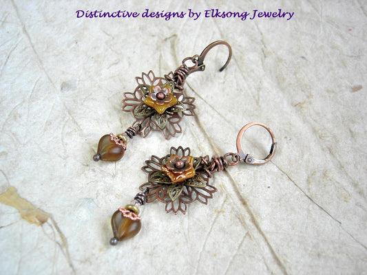 Sunflower earrings with antiqued copper & brass filigree petals, yellow glass flowers & heart shaped beads. 