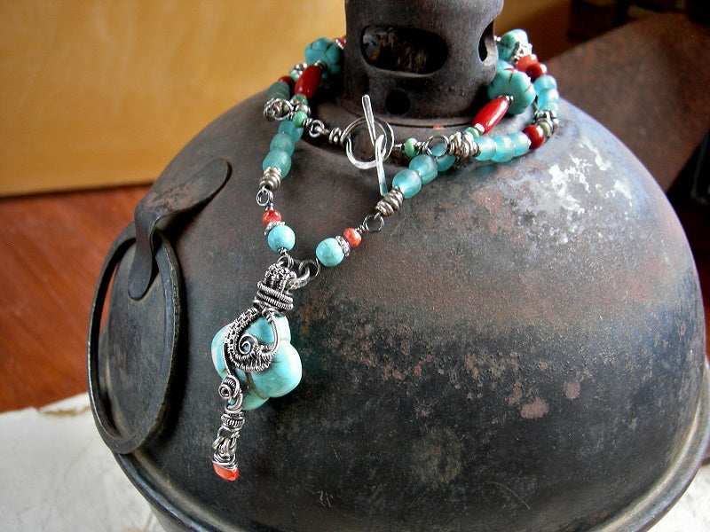 Gemstone & silver necklace with vivid red bamboo coral, genuine turquoise & colored magnesite, silver Bali style beads, Java glass & sterling wire wrapped focal. 