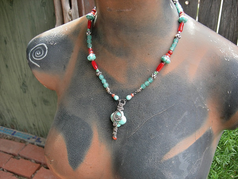 East Meets West necklace with vivid red bamboo coral, genuine turquoise & colored magnesite, silver Bali style beads, Java glass & sterling wire wrapped focal. 