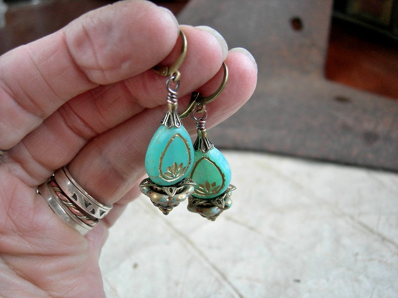 Opalescent aqua lotus flower earrings, with glass drops, glass cup flowers & antiqued brass details. 