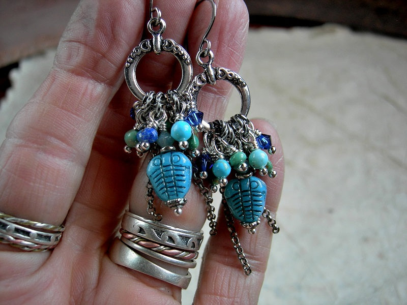 Lush trilobite earrings, clusters of Swarovski crystal, faceted lapis, genuine turquoise & sterling chain falls. 